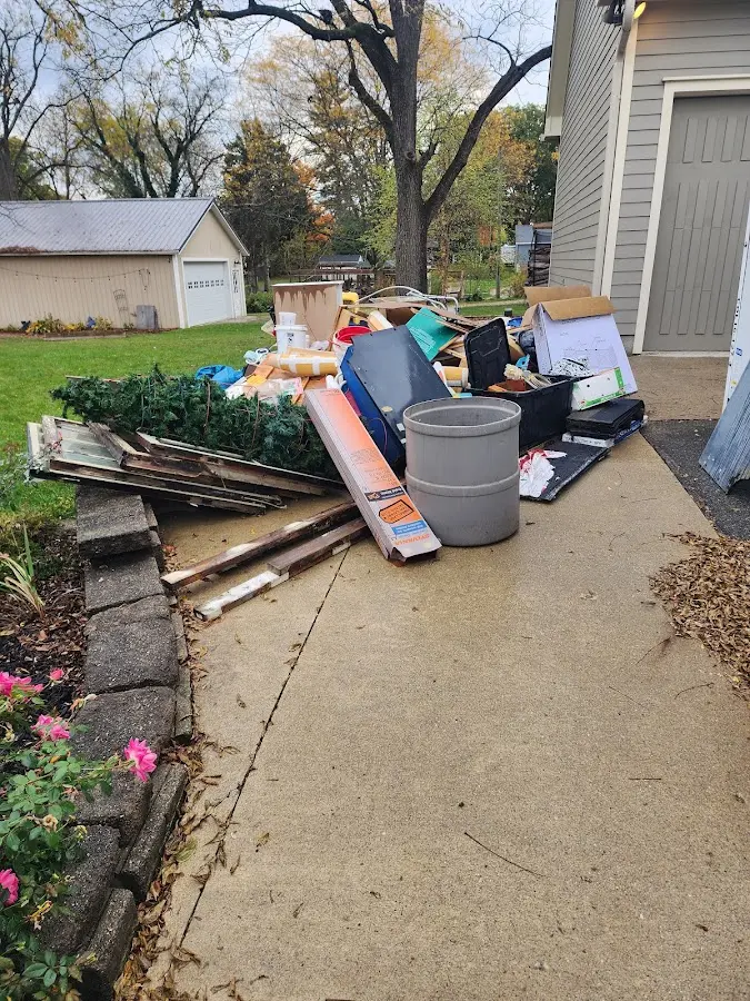 Dumpster being loaded with debris for Commercial Dumpster Rental in Heber